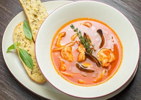 Fish soup with tomatoes and mussels Stock Photos
