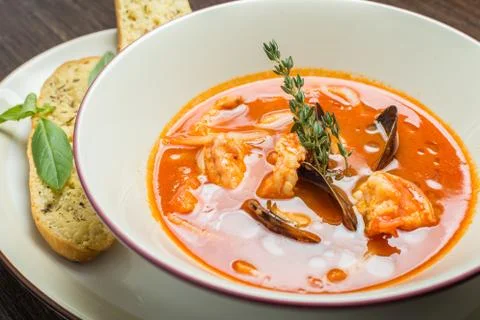 Fish soup with tomatoes and mussels Stock Photos