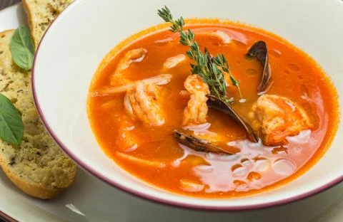 Fish soup with tomatoes and mussels Stock Photos