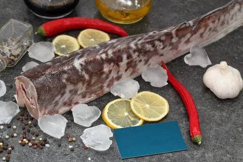 Fish with spices on the table Stock Photos