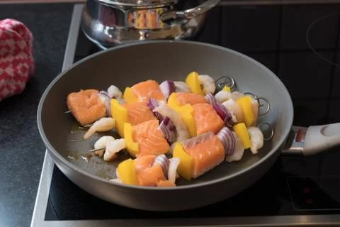 Fish spits in a pan Stock Photos
