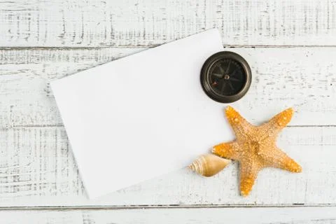 Fish star and sea shells on the wooden background Stock Photos