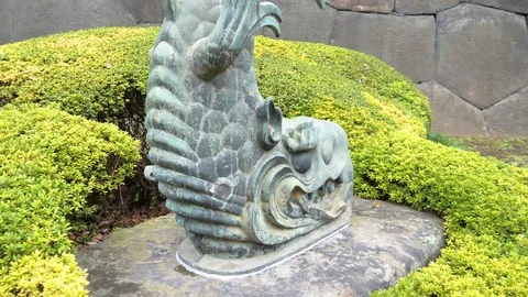 A fish statue on the park inside the Imperial Gardens in Tokyo Japan Stock Footage 121406042