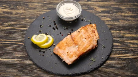 Fish steak on a wooden table Stock Footage 65114185