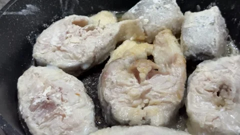 Fish Steaks Cooking in Flour Coating Pan Frying Close-up Shot Stock Footage 329751626