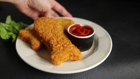 Fish sticks fishs shaped breaded fish nuggets fast food fresh delicious food Stock Footage 310546166