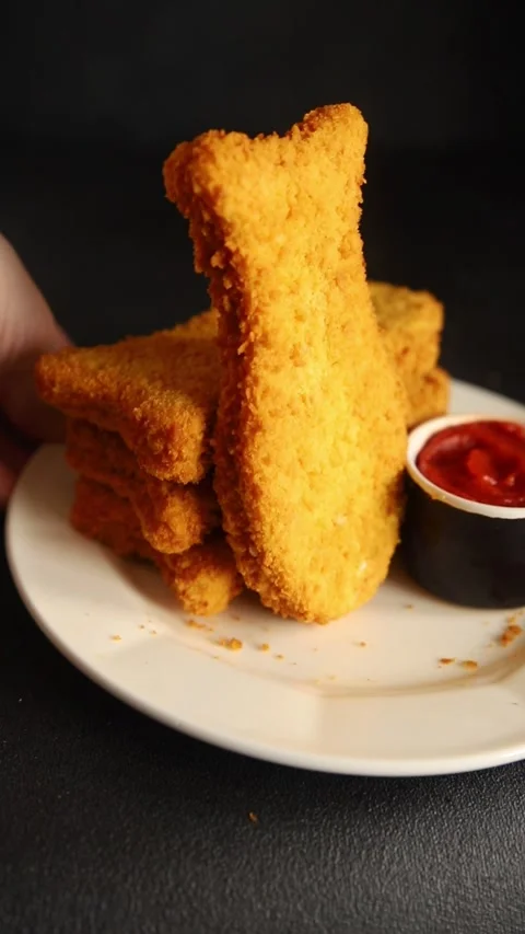 Fish sticks fishs shaped breaded fish nuggets fast food fresh delicious food Stock Footage 310546171