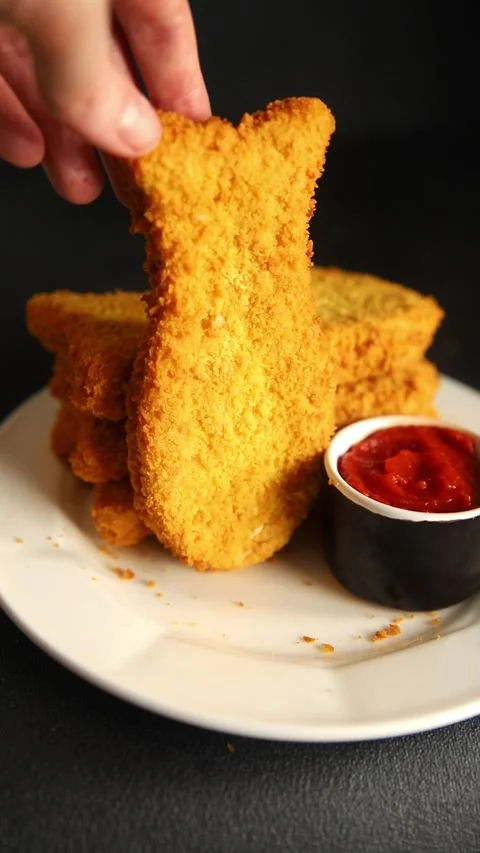Fish sticks fishs shaped breaded fish nuggets fast food fresh delicious food Stock Footage 310546175
