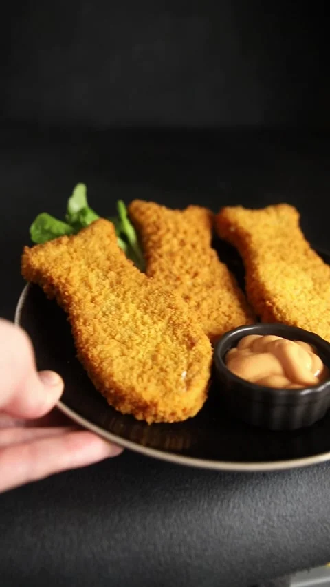 Fish sticks fishs shaped breaded fish nuggets fast food fresh delicious food Stock Footage 310546178