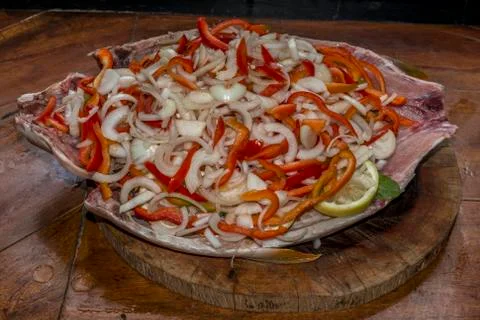 Fish stuffed with pepper and onion Stock Photos