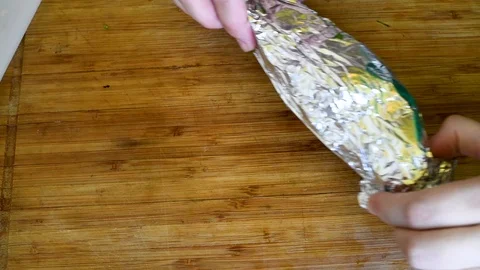 Fish stuffed with vegetables in foil for baking Stock Footage 95067143