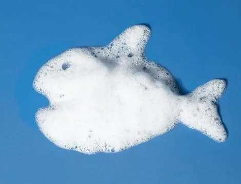 Fish from the suds on blue background Stock Photos