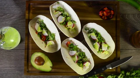 Fish Tacos with Avocado and Beer Stock Footage 243498281