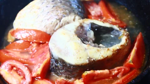 Fish in tomato sauce Stock Footage 302159503