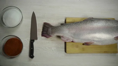Fish trout on the table Stock Footage 143593327