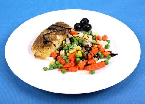 Fish with vegetables and olive Stock Photos