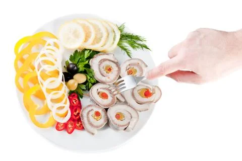 Fish with vegetables and olives Stock Photos