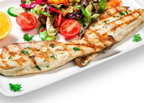 Fish with vegetables Stock Photos