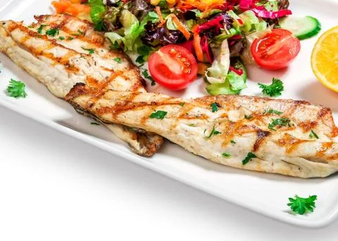 Fish with vegetables Stock Photos