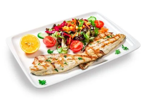 Fish with vegetables Stock Photos