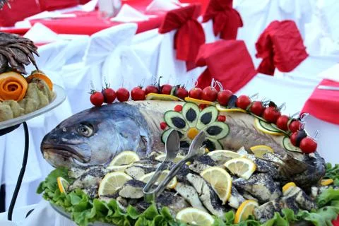Fish with vegetables Stock Photos