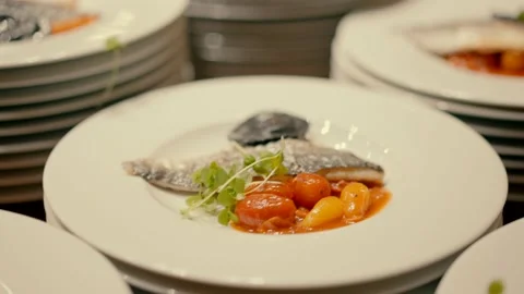 Fish with vegetables on the white plate Video stock 220129864