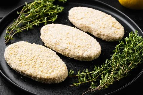 Fishcake burger , on black wooden table background Stock Photos