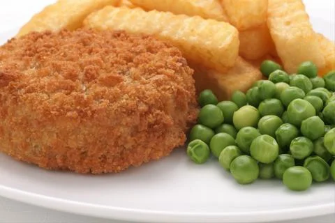 Fishcake chips and peas Stock Photos