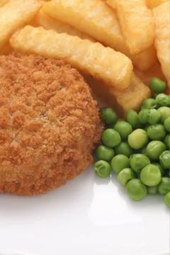 Fishcake chips and peas Stock Photos