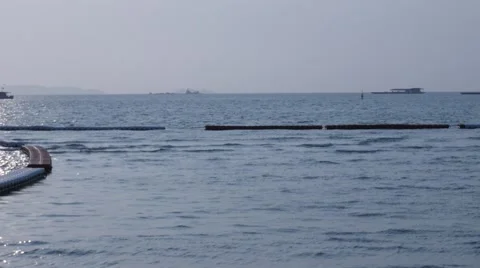 Fisher boy silhouette from afar hyperlapse from Pattaya beach Stock Footage 61541808