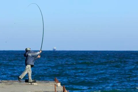 Fisher makes a throw Stockfoto's
