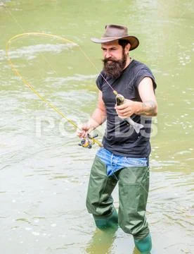 Fisher weekend activity. Fisher with fishing equipment. Fish on hook. Leisure in Stock Photos