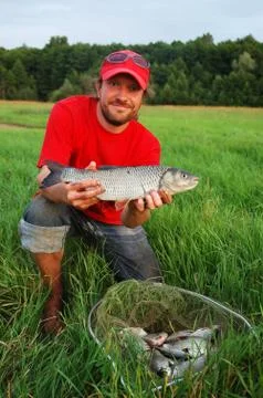 Fisherman and fish Foto stock