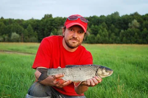 Fisherman and fish Foto stock