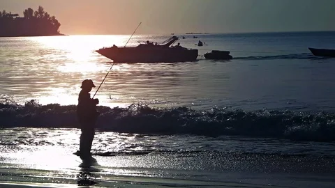 Fisherman on the beach. Evening time.  库存影片 74623766