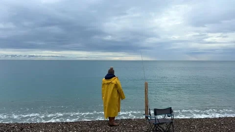 A fisherman on the beach Stock Footage 236482014