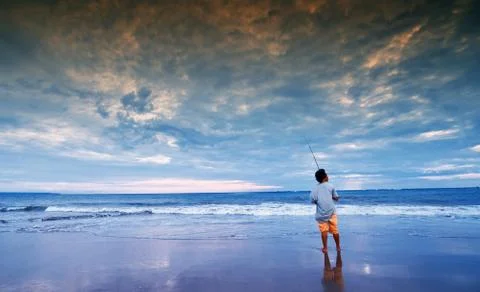 Fisherman on beach Stock Photos