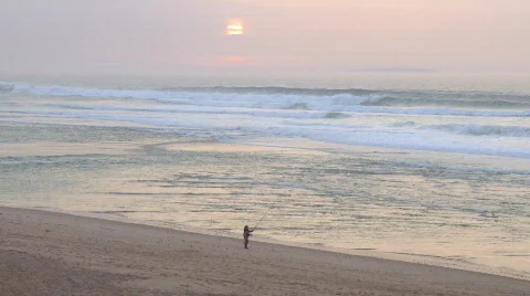 Fisherman on beach sunset Stock Footage 299687