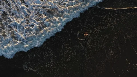 Fisherman at beach waves top view aerial 4k Stock Footage 94469070