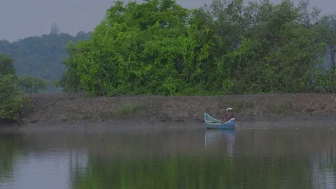 Fisherman on a boat casting the Net. Stock Footage 78844120