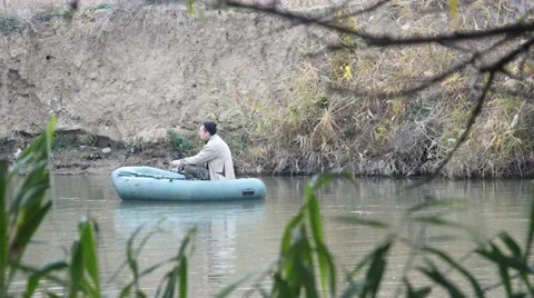 Fisherman in boat Stock Footage 43801082