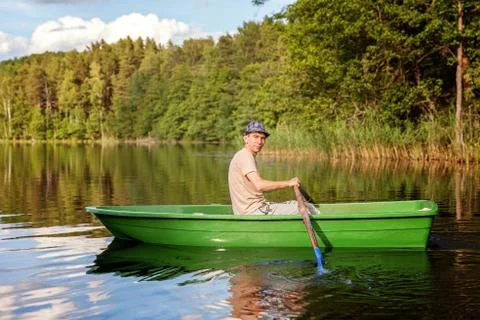 A fisherman in a boat Stock Photos