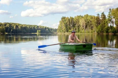 A fisherman in a boat Stock Photos