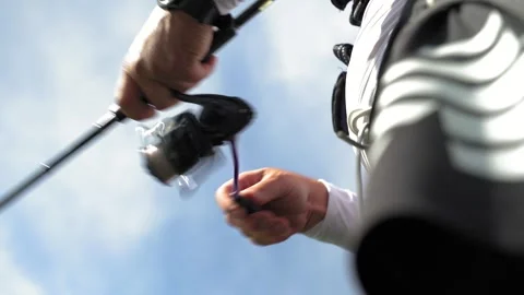 A fisherman on a boat pulls a fish after a bite. Fishing reel. Ukraine. Stock Footage 248308327