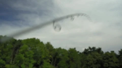 A fisherman on a boat pulls a fish after a bite. Fishing reel. Ukraine. Stock Footage 248308575