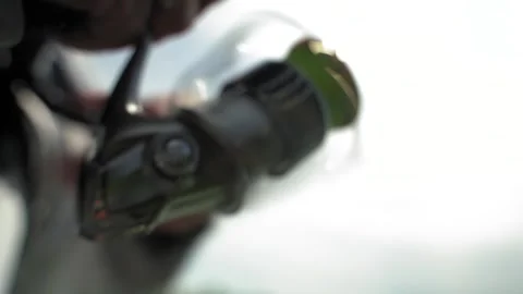 A fisherman on a boat pulls a fish after a bite. Fishing reel. Ukraine. Stock Footage 248308581