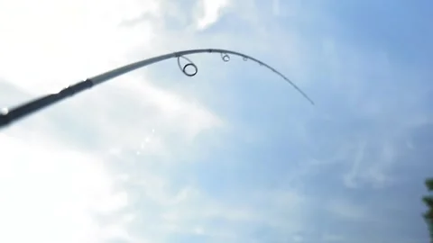 A fisherman on a boat pulls a fish after a bite. Fishing reel. Ukraine. Stock Footage 248308759