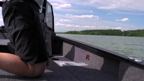 A fisherman on a boat pulls a fish after a bite. Fishing reel. Ukraine. Stock Footage 248309569