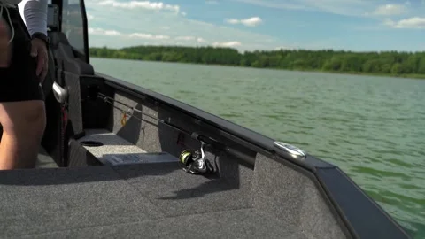 A fisherman on a boat pulls a fish after a bite. Fishing reel. Ukraine. Stock Footage 248309573