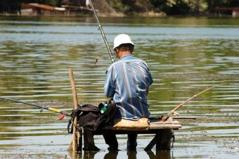 Fisherman on the bridge Stock Photos